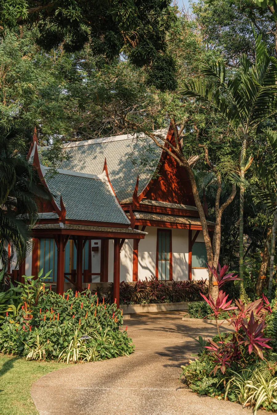 Thai pavilions surrounded by tropical plants in the gardens of Chiva-Som Hua Hin
